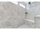 Tiled walk-in shower with a bench seat and a shower head at 3417 Mission Olive Pl, New Hill, NC 27562