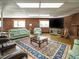 Entertainment space with brick walls, large TV, fireplace and plush sofas at 3680 15-501 N, Pittsboro, NC 27312