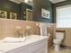 Bathroom featuring tile work, decorative art, neutral color scheme, and natural light at 3680 15-501 N, Pittsboro, NC 27312