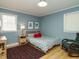 Cozy bedroom with hardwood floors, natural light, and comfortable furnishings at 3680 15-501 N, Pittsboro, NC 27312