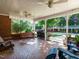 Back porch with brick floors, outdoor furniture, a barbecue grill, and a backyard view at 3680 15-501 N, Pittsboro, NC 27312