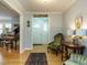 Elegant entryway featuring a piano and vintage furniture, creating a welcoming ambiance at 3680 15-501 N, Pittsboro, NC 27312