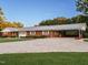Attractive brick ranch with a spacious driveway and covered carport on a lush green lot at 3680 15-501 N, Pittsboro, NC 27312