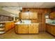 Kitchen with wood cabinets and plenty of countertop space at 3680 15-501 N, Pittsboro, NC 27312