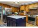 Well-equipped kitchen with a central island and stainless steel appliances at 3680 15-501 N, Pittsboro, NC 27312
