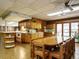 Open-concept kitchen with wood cabinets and a dining table at 3680 15-501 N, Pittsboro, NC 27312