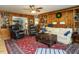 Spacious living room featuring hardwood floors, comfortable seating, and built-in bookcases at 3680 15-501 N, Pittsboro, NC 27312