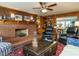 Inviting living room with brick fireplace, wood accents, and comfortable seating at 3680 15-501 N, Pittsboro, NC 27312