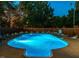 In-ground illuminated pool with chairs, diving board, brick fence and attached basketball court at 3680 15-501 N, Pittsboro, NC 27312