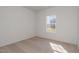 Bright bedroom featuring carpet, neutral walls and a large window offering neighborhood views at 402 Suhani Ln, Clayton, NC 27520