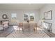 Comfortable dining area featuring neutral furniture and an open view to the living area at 402 Suhani Ln, Clayton, NC 27520