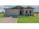 Charming single-Gathering home featuring a two-car garage and well-manicured lawn at 402 Suhani Ln, Clayton, NC 27520