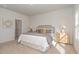 Relaxing main bedroom featuring neutral walls, soft carpet, and natural light at 402 Suhani Ln, Clayton, NC 27520