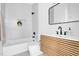 Sleek bathroom featuring white subway tile, a modern vanity, and black fixtures offers a luxurious and contemporary space at 409 Alston St # 101, Raleigh, NC 27601