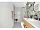 Stylish bathroom with a mosaic tiled floor, modern vanity, and a walk-in shower at 409 Alston St # 101, Raleigh, NC 27601