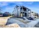 Modern two-story home with a yellow front door, balcony, and landscaped front yard at 409 Alston St # 101, Raleigh, NC 27601
