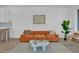 Cozy living room showcasing stylish decor, herringbone floors, and ample natural light at 409 Alston St # 101, Raleigh, NC 27601