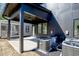 Spacious covered back patio with access to the backyard, modern design elements, and ample space at 409 Alston St # 102, Raleigh, NC 27601