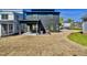 Exterior of a modern two-story home with a spacious backyard, covered patio, and contemporary design at 409 Alston St # 102, Raleigh, NC 27601