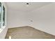 Large bright bedroom with hardwood floors and an exterior window with a view of the outside at 409 Alston St # 102, Raleigh, NC 27601