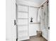 Organized closet space with custom shelving, hanging rods and space for storage baskets at 409 Alston St # 102, Raleigh, NC 27601