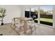 Bright dining room with large windows overlooking the backyard at 409 Alston St # 102, Raleigh, NC 27601