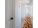 Bright hallway with wood floors, modern runner rug, and white walls at 409 Alston St # 102, Raleigh, NC 27601