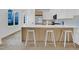 Modern kitchen island with white countertops and seating at 409 Alston St # 102, Raleigh, NC 27601