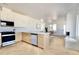 Open-concept kitchen with stainless steel appliances and herringbone floors at 409 Alston St # 102, Raleigh, NC 27601
