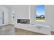 Modern living room with herringbone floors, a view of the front yard, and built in aquarium at 409 Alston St # 102, Raleigh, NC 27601