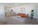 Bright living room features modern furniture and a view of the kitchen at 409 Alston St # 102, Raleigh, NC 27601