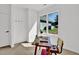 Bright office space with a desk, chair, rug, and a large window showcasing the property's exterior at 409 Alston St # 102, Raleigh, NC 27601
