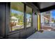 Stylish front porch with a yellow door, black trim, and modern railing at 409 Alston St # 102, Raleigh, NC 27601