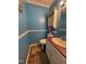Cozy powder room featuring a vintage vanity, decorative accents, and updated fixtures at 472 Cedar Ln, Mebane, NC 27302