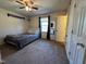 Simple bedroom with a ceiling fan, neutral walls, and good natural light at 472 Cedar Ln, Mebane, NC 27302
