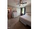 Relaxing bedroom with a ceiling fan, closet, and sunny window at 472 Cedar Ln, Mebane, NC 27302