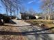 Charming single-story home with a well-maintained front yard, long driveway, and inviting curb appeal at 472 Cedar Ln, Mebane, NC 27302