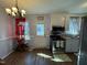 Well-lit kitchen with stainless steel appliances, ample counter space, and access to backyard at 472 Cedar Ln, Mebane, NC 27302