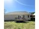 View of the backyard of this single-Gathering home with a nice wooden deck at 495 Cheves Rd # 495, Zebulon, NC 27597