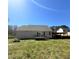 Spacious backyard featuring a patio and large grassy area perfect for outdoor activities at 495 Cheves Rd # 495, Zebulon, NC 27597