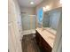 This well-lit bathroom features double sinks, ample counter space, and a shower/tub combination at 495 Cheves Rd # 495, Zebulon, NC 27597