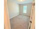 Empty bedroom with neutral walls and carpet, a bright window, and closet at 495 Cheves Rd # 495, Zebulon, NC 27597