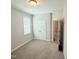 Bright bedroom featuring neutral colors, a double door closet, and a window letting in natural light at 495 Cheves Rd # 495, Zebulon, NC 27597