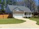 Home exterior with an attached garage and nice yard at 495 Cheves Rd # 495, Zebulon, NC 27597