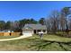 Charming single-story home with a well-manicured lawn, attached garage, and inviting front porch at 495 Cheves Rd # 495, Zebulon, NC 27597