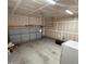 Spacious garage with concrete floor, drywall walls, an automatic garage door, and overhead lighting at 495 Cheves Rd # 495, Zebulon, NC 27597