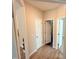 The hallway boasts wood-look floors and multiple doorways, connecting various rooms in the house at 495 Cheves Rd # 495, Zebulon, NC 27597