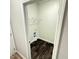 The laundry room is well-lit and has dark wood-look floors, shelving, and washer/dryer hookups at 495 Cheves Rd # 495, Zebulon, NC 27597