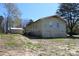 Spacious lot featuring a home with a partial basement and an additional storage shed for ample storage at 5301 Daleview Dr, Raleigh, NC 27610