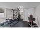 Basement workout area with weight rack and rubber flooring at 539 N Oneil St, Clayton, NC 27520